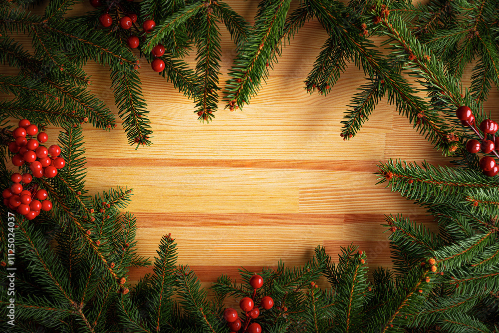 Christmas background. Fir branches on a wooden background. New Year and Christmas decorations as a festive background.