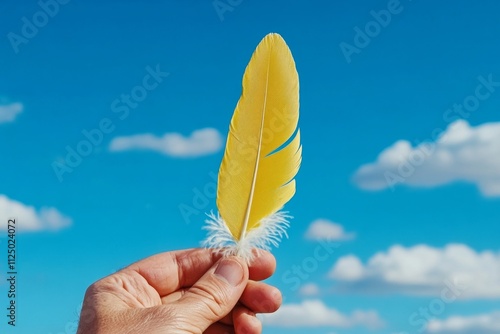 A close-up of a hand holding a feather floating in the wind, symbolizing lightness and the fleeting nature of dreams