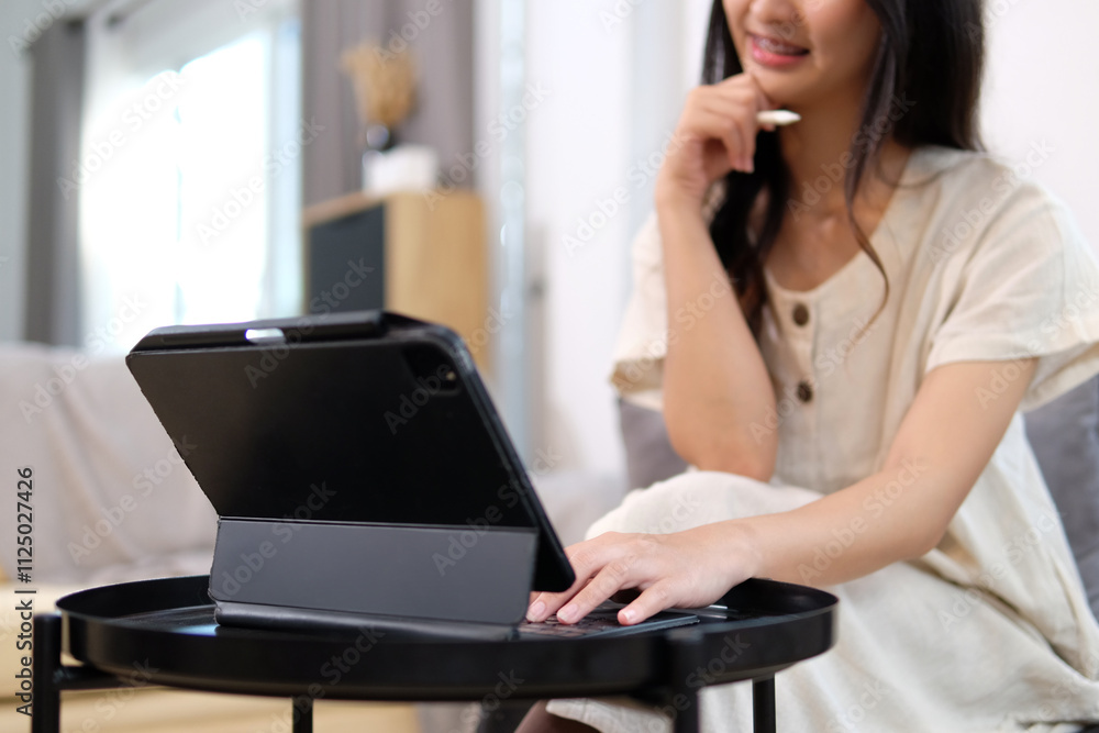 Woman using tablet to search for information Woman using tablet to search for information