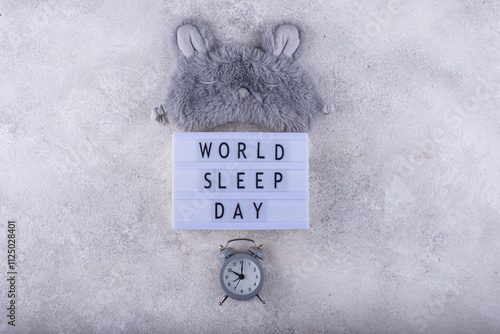 World sleep day sign with grey eye mask photo