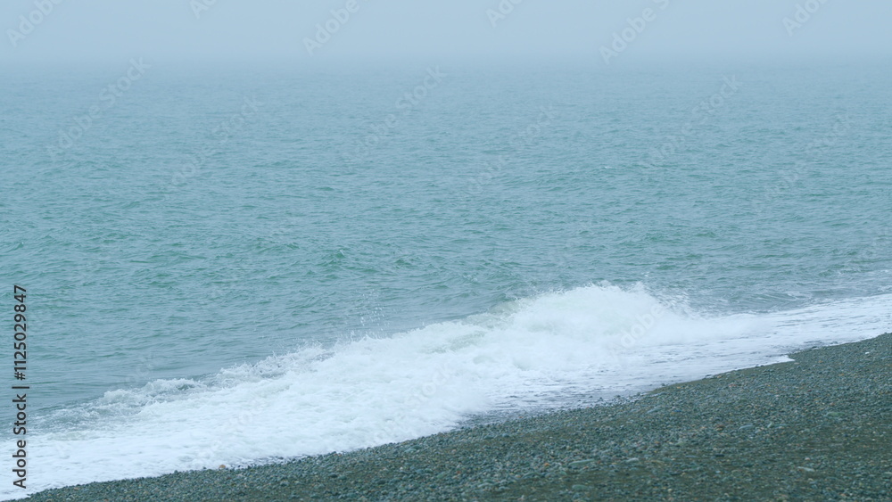 Fototapeta premium Sea Background Dissolving In The Fog. Abstract Landscape Of The Sea With Fog. Slow motion.