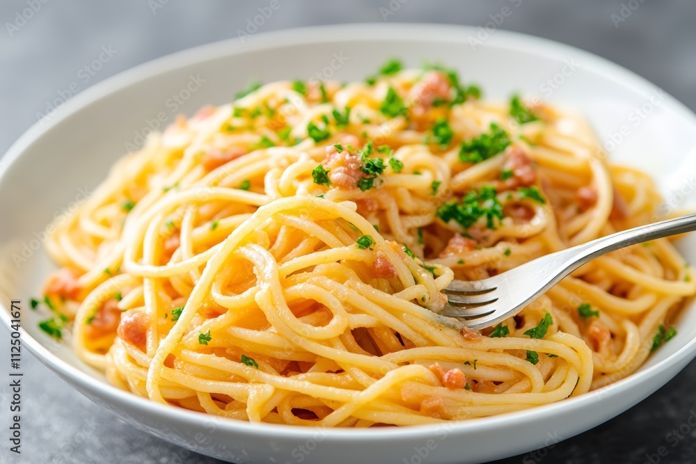 Fork Twirling Spaghetti with Basil Garnish and Grated Parmesan on a Plate Fork Twirling Spaghetti with Basil Garnish and Grated Parmesan on a Plate