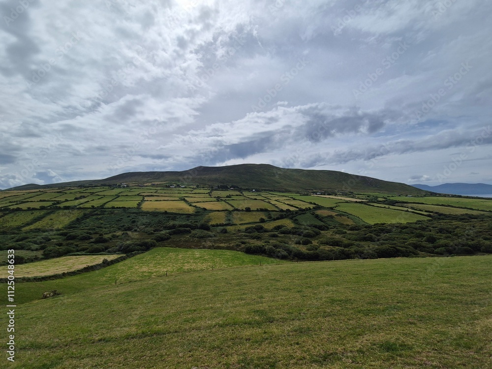 Fototapeta premium Mountain Landscape with Cloudy Sky and Greenery
