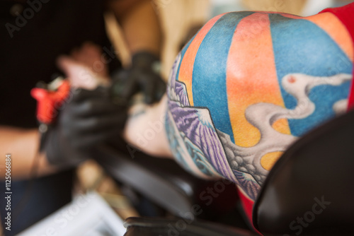 Focus On Finished Tattoo Art On Shoulder