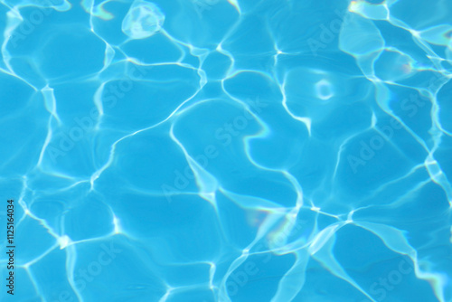 Fotografi reflections of light on the blue water of the empty swimming pool ideal as a neu
