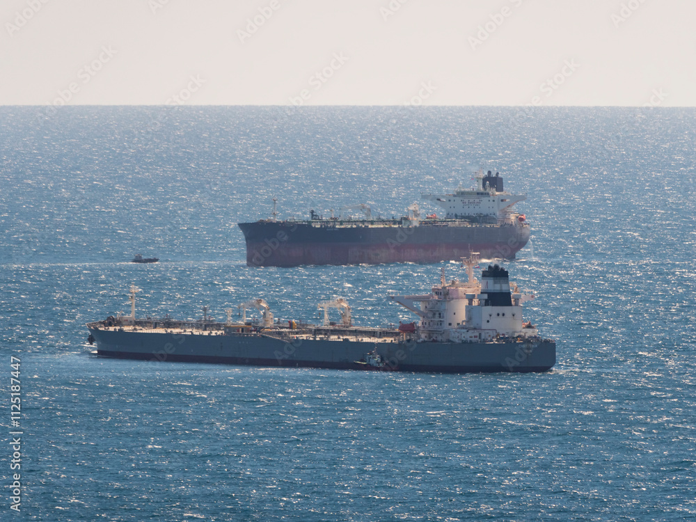 Sea freighter sailing in the middle of the ocean with big waves Sea freighter sailing in the middle of the ocean with big waves
