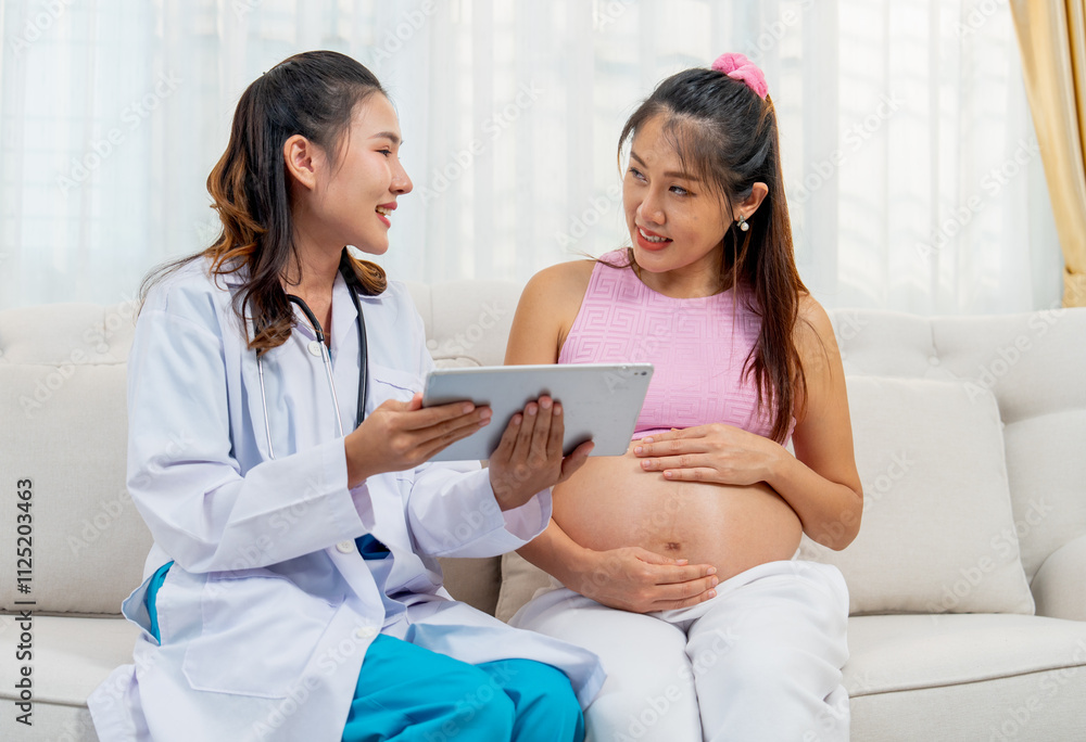 Obraz premium Doctor or nurse sit together with Asian pregnancy woman and discuss abouth mother health at home with happiness.