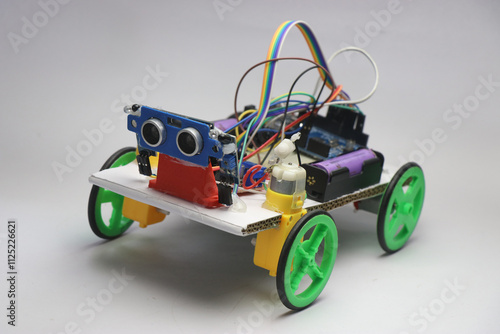 Human following robot car built with various electronics components. Robotic car made with ultrasonic sensor and infrared sensors photo