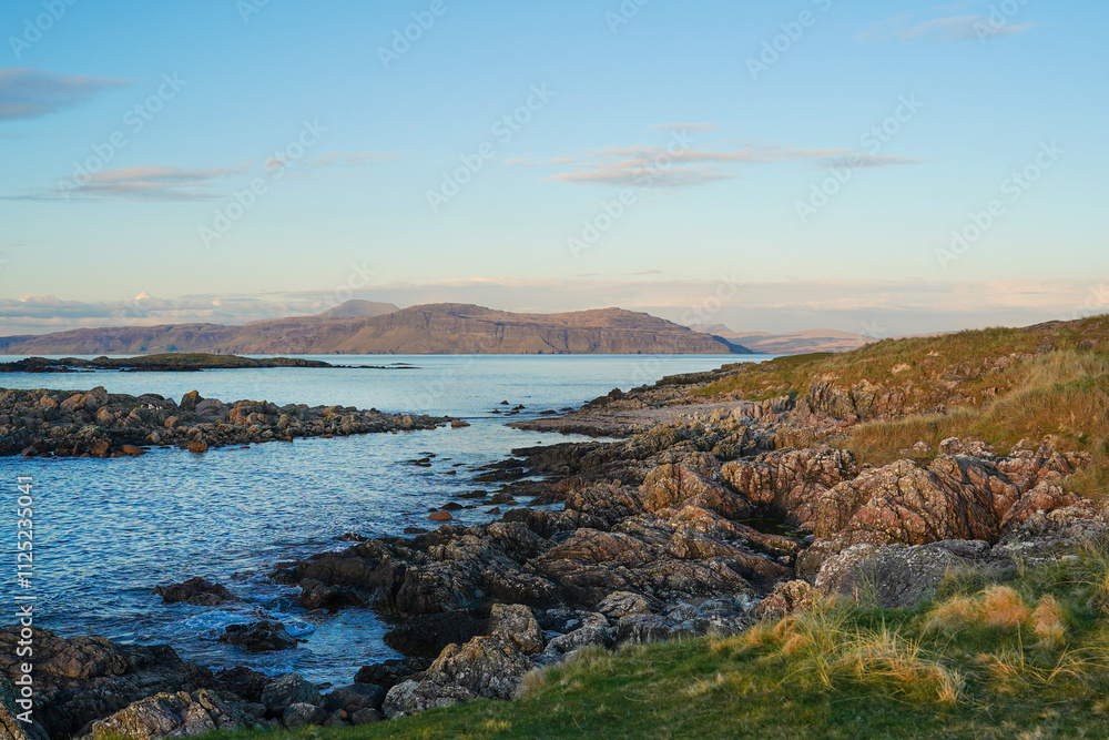 View from a beach in the north of the isle of Iona. Iona is a small island of the Inner Hebrides in the west of Scotland. View from a beach in the north of the isle of Iona. Iona is a small island of the Inner Hebrides in the west of Scotland.