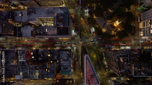 Aerial views capture cars navigating an intersection in the Fifth Avenue in the Flatiron District neighborhood of Manhattan in New York City at night