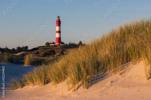 Wunderschöne Dünen mit Leuchtturm auf der Nordsee Insel Amrum. photo