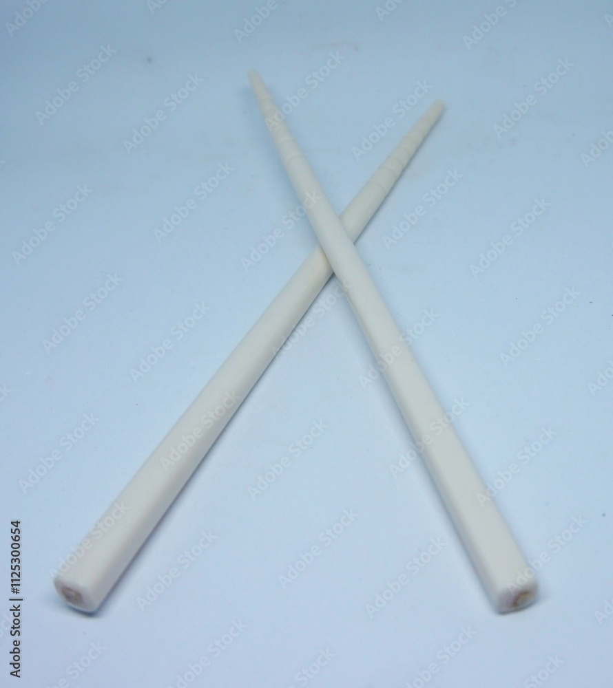 Fototapeta premium chopsticks, white children's chopsticks, noodle eating utensils