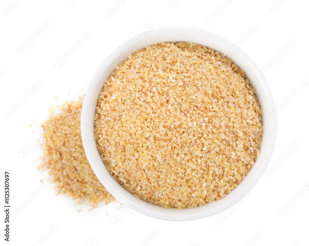 Raw wheat groats in bowl isolated on white, top view Raw wheat groats in bowl isolated on white, top view
