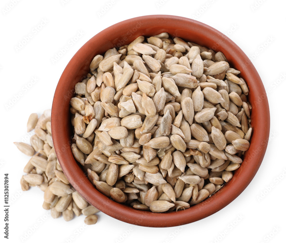 Peeled sunflower seeds in bowl isolated on white, top view Peeled sunflower seeds in bowl isolated on white, top view