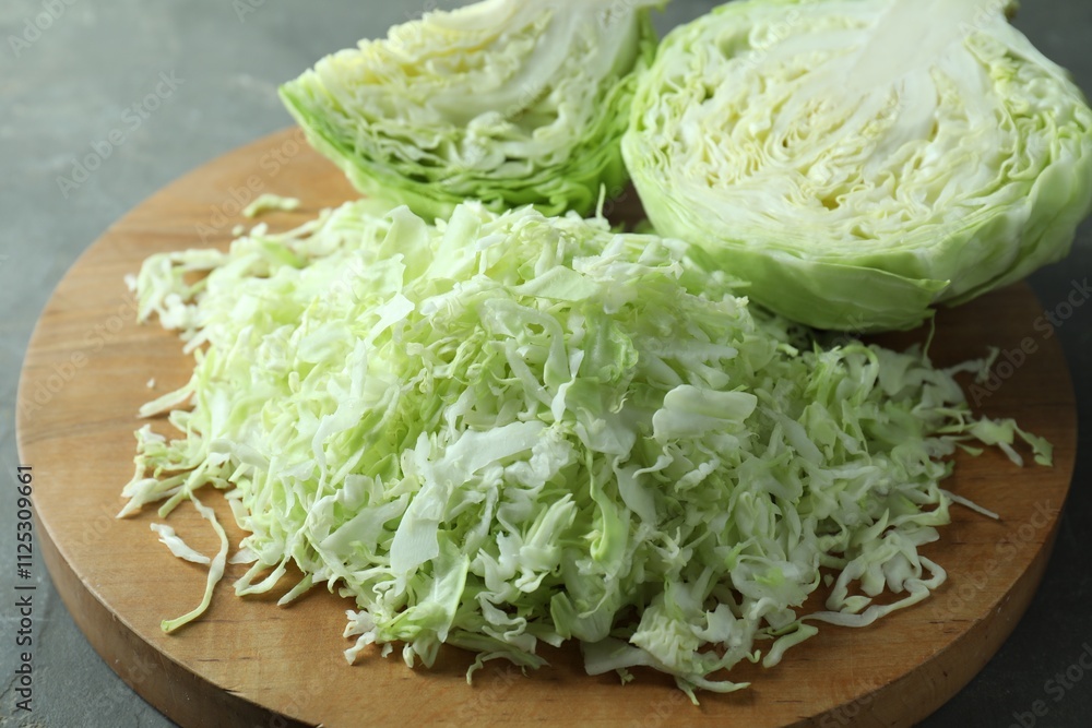 Fresh shredded cabbage on grey table, closeup Fresh shredded cabbage on grey table, closeup