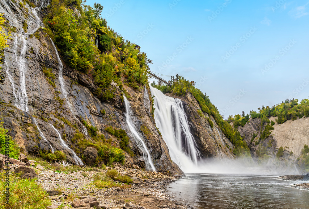 A view along the shoreline at the bottom of the Montmorency falls near Quebec City, Canada in the fall A view along the shoreline at the bottom of the Montmorency falls near Quebec City, Canada in the fall