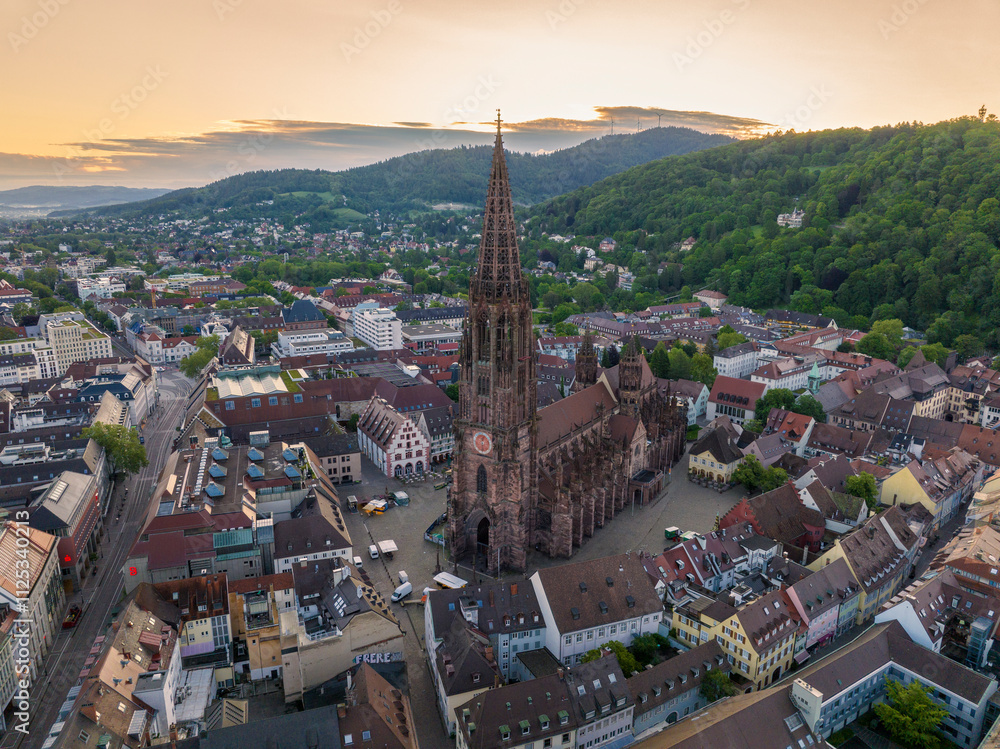 Freiburger Dom Close up Drone Shot made at Morning in Freiburg im Breisgau, Germany at Sunrise. Cathedral in Freiburg