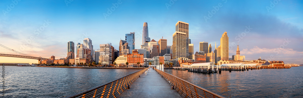 the skyline of san francisco during sunrise seen from pier 14