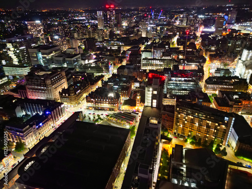 Wallpaper Mural Aerial Night View of Illuminated Central Manchester City and Downtown Buildings, England United Kingdom. High Angle Footage Was Captured with Drone's Camera on May 4th, 2024 During Midnight. Torontodigital.ca