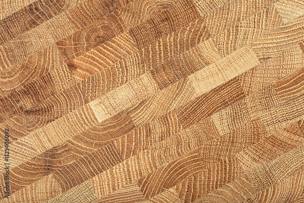 Fototapeta premium Oak wooden board as background, top view. Cross section of tree trunk. Natural durable end grain hard wood cutting board.