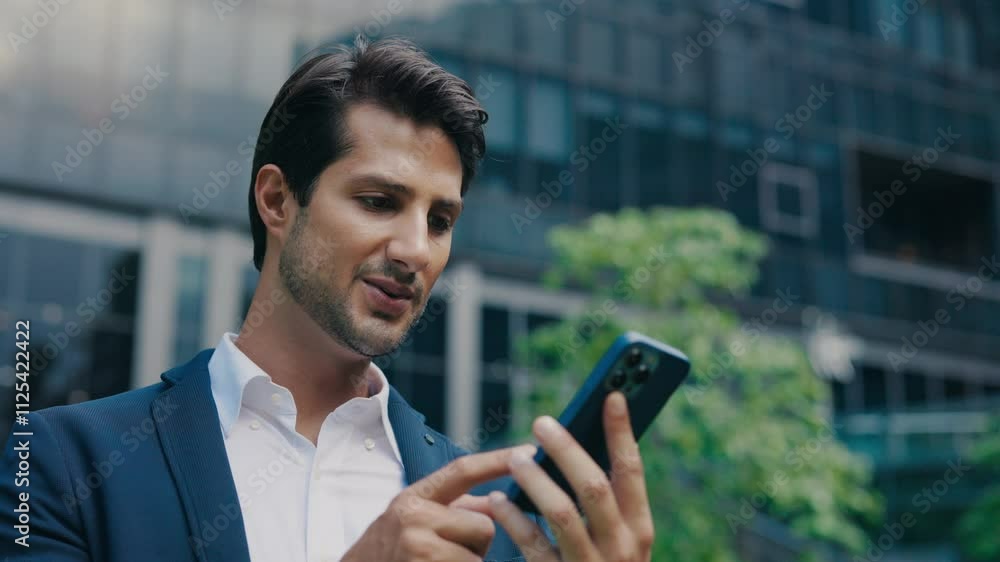Excited Handsome Male Receiving SMS Message Offer Opportunity Online While Standing Outside. Excited Handsome Male Receiving SMS Message Offer Opportunity Online While Standing Outside.
