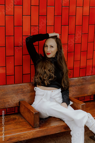 Young Woman Embracing Style in Trendy Caps and Casual Fashion Attire