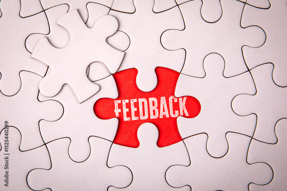 Feedback Concept. White puzzle pieces on an red background Feedback Concept. White puzzle pieces on an red background