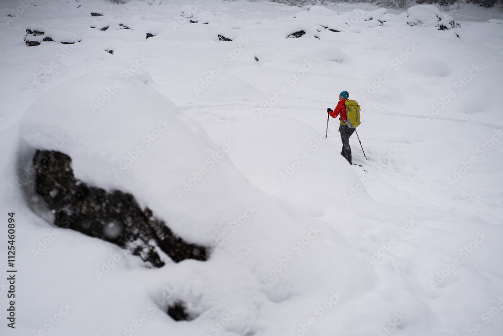 Fil woman ski touring in the backcountry of Kananaskis Country, Alberta, Canada. Fil woman ski touring in the backcountry of Kananaskis Country, Alberta, Canada.