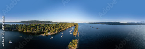 Scenic view of the anchorage on Wallace Island surrounded by forests on a clear sunny day, british columbia, canada