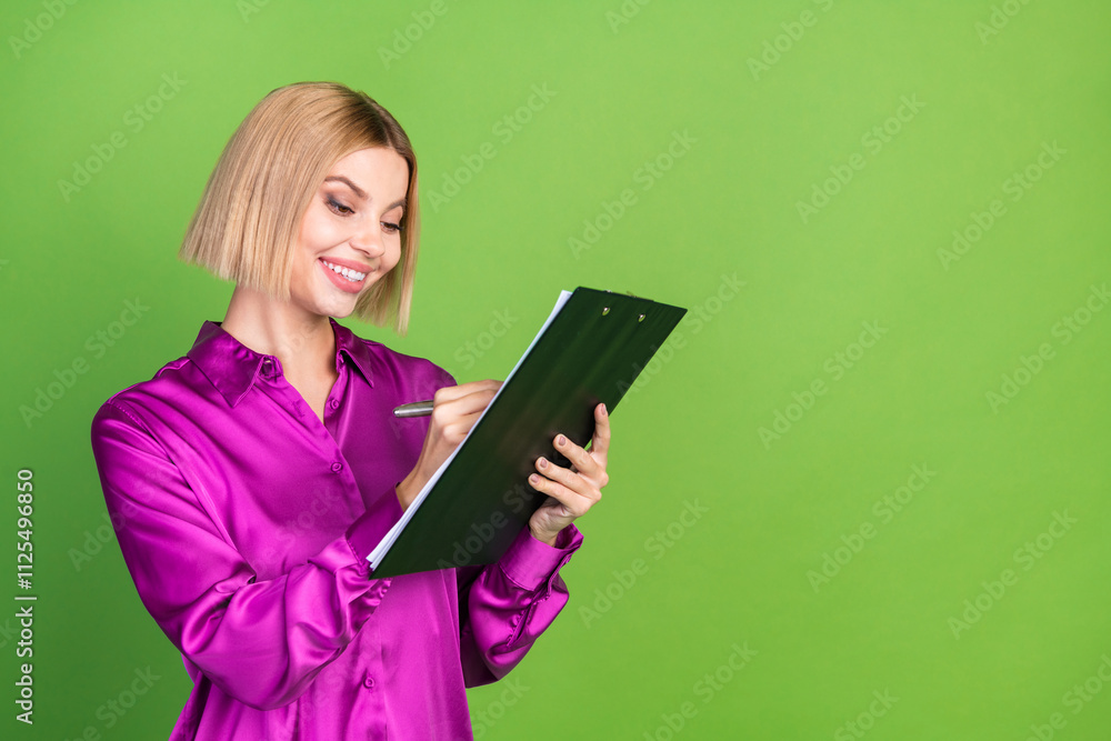 Photo of pretty lovely nice girl wear stylish pink clothes write document empty space isolated on green color background Photo of pretty lovely nice girl wear stylish pink clothes write document empty space isolated on green color background