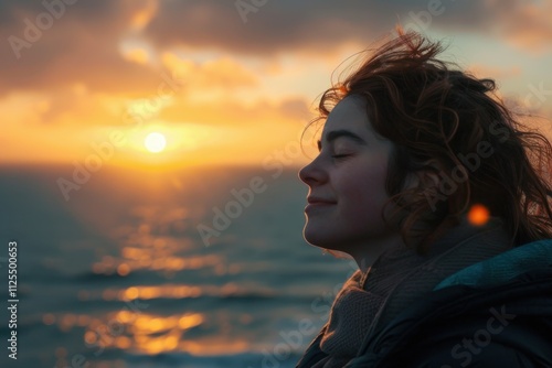 Serene person meditating by tranquil ocean at sunset