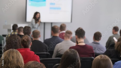Wallpaper Mural Audience attentively listens to speaker during business seminar presentation in conference room setting Torontodigital.ca