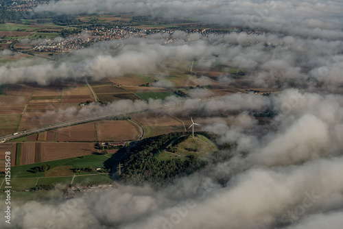 Windrad Grüner Heiner Ditzingen zwischen Wolken photo