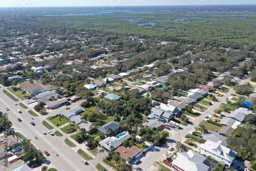 Aerial looking west over New Smyrna Beach, Florida towards the Spruce Creek and mangroves.