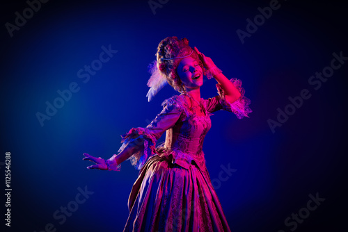 Photo of dreamy positive marie antoinette wear rich dress smiling dancing empty space isolated blue color background