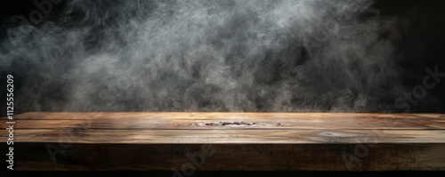 A wooden table, with smoke rising in a dark background, provides an excellent setting for photographing food, barbecue themes, and culinary illustrations.