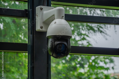 Surveillance camera mounted on the wall