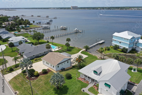 Aerial looking southwest over the Intracoastal Waterway ( Halifax River) and Daytona Beach Shores wealthy riverfront houses and boat docks.
