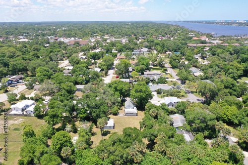 Aerial view of Ormond Beach, Florida suburban neighborhood houses and trees.