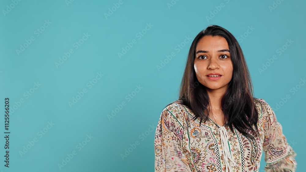 Happy indian person having fun, dancing on rhythm, enjoying leisure time. Cheerful woman entertaining herself doing funky movements, isolated over studio background, camera B Happy indian person having fun, dancing on rhythm, enjoying leisure time. Cheerful woman entertaining herself doing funky movements, isolated over studio background, camera B