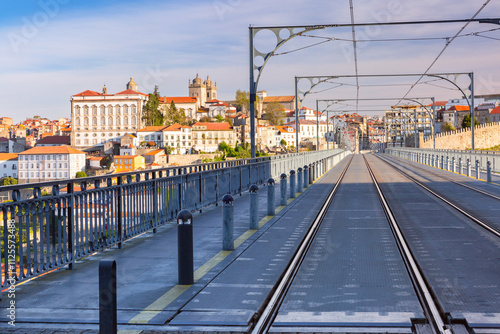 Dom Luis I Bridge in Porto, Portugal, featuring tram tracks and overlooking the historic cityscape