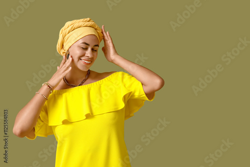 Smiling young woman in yell...