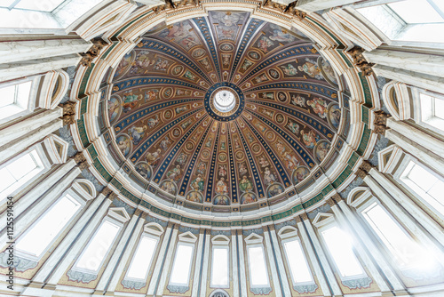 Ornate, painted dome ceiling, depicting religious figures and scenes.  Richly detailed, with intricate patterns and gilded accents. photo