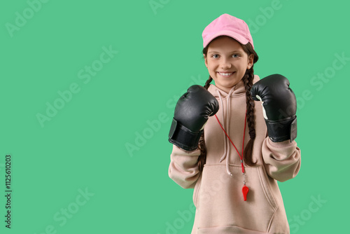 Cute trainer in boxing glov...