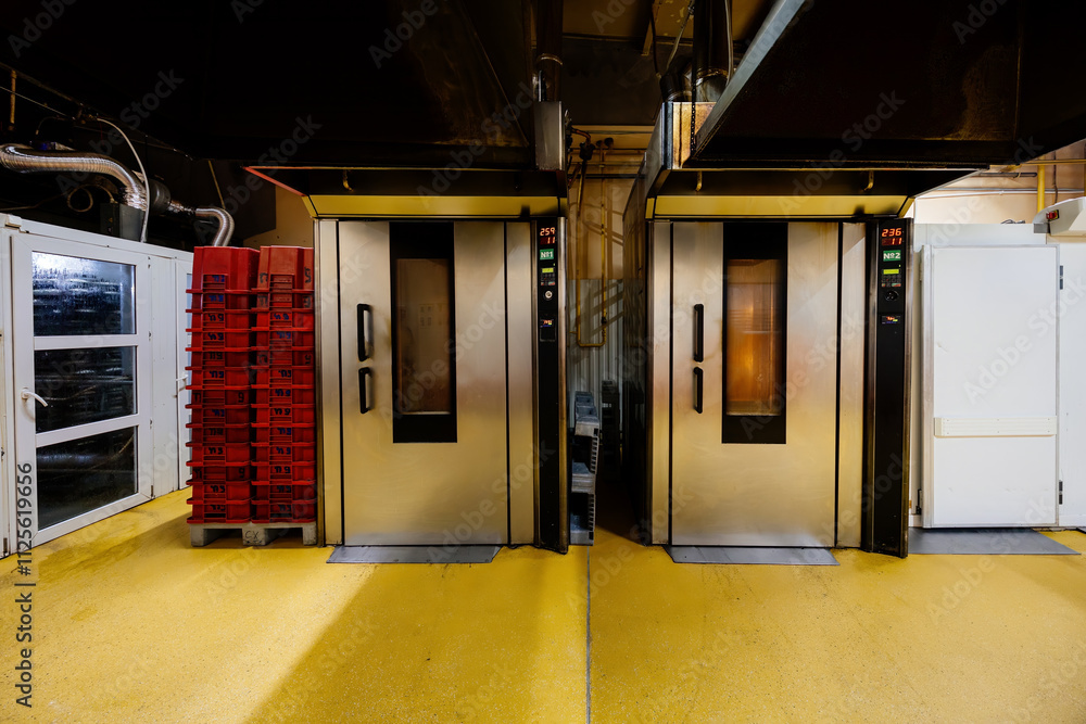 Modern bakery. Industrial ovens for baking bread, loafs, cakes and cookies Modern bakery. Industrial ovens for baking bread, loafs, cakes and cookies