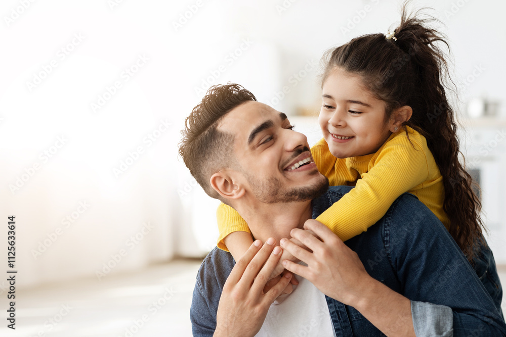 Cute Happy Little Arab Girl Embracing Her Father From Back And Laughing, Young Middle Eastern Dad Bonding With His Small Daughter At Home, Loving Muslim Family Having Fun Together, Closeup Cute Happy Little Arab Girl Embracing Her Father From Back And Laughing, Young Middle Eastern Dad Bonding With His Small Daughter At Home, Loving Muslim Family Having Fun Together, Closeup