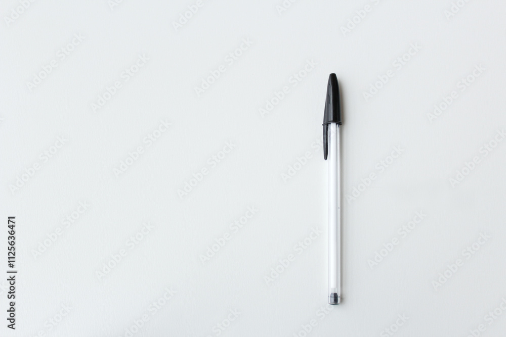 One black and white ballpoint pen isolated with copy space. Office supply, school stationery, authorship, letter writing concept. Simple and minimalist banner design. One black and white ballpoint pen isolated with copy space. Office supply, school stationery, authorship, letter writing concept. Simple and minimalist banner design.