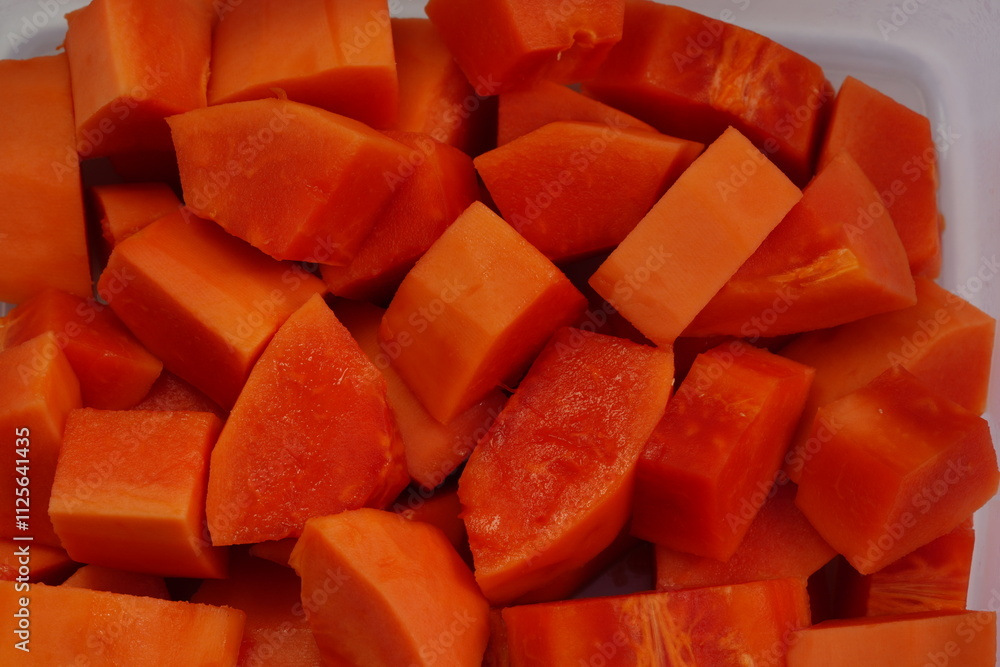 Papaya cut into pieces, ready to eat Papaya cut into pieces, ready to eat