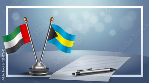 United Arab Emirate and Bahamas National flags on small table with bokeh background, cooperative relationship
