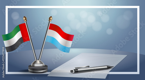 United Arab Emirate and Luxembourg National flags on small table with bokeh background, cooperative relationship